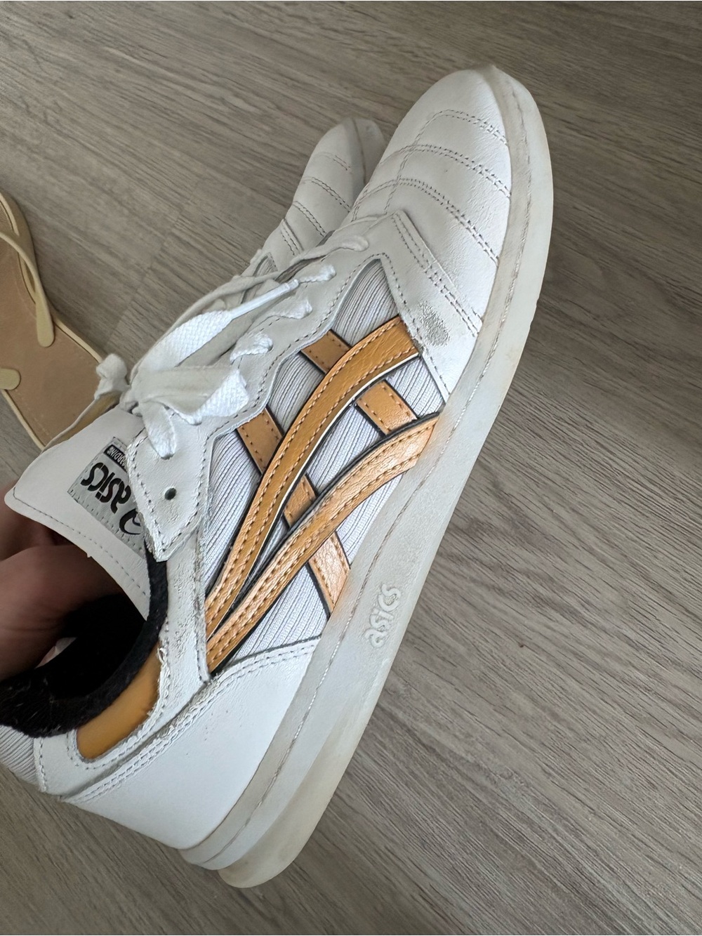 ASICS White Athletic Shoes with Gold Accent Stripes size 9